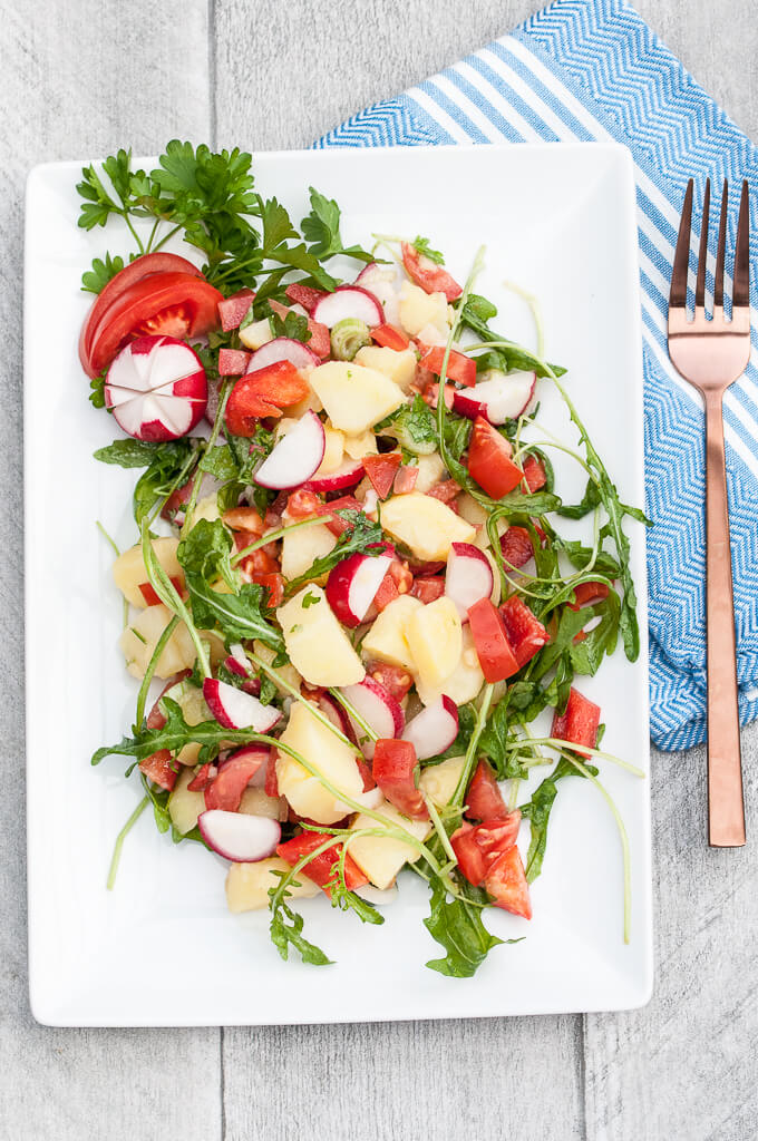 Healthy Vegetable Potato Salad Recipe w/ Bell peppers, tomatoes, radishes, arugula and more! No mayo ;) - VeganFamilyRecipes.com - #vegetables #potatoes